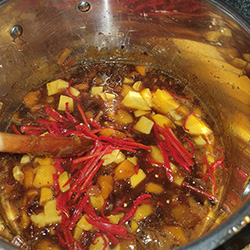 ingredients cooking after one hour with final ingredients added.